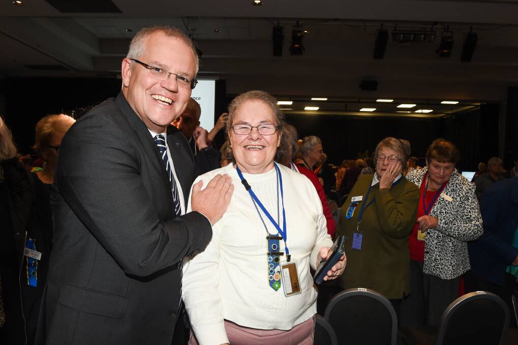 Scott Morrison with Margaret Baxter, who was knocked over as the incident unfolded.