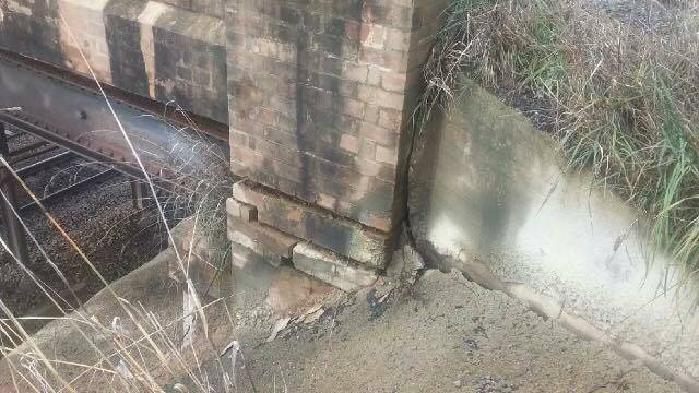 The damaged Burley Griffin Way bridge over the railway line at Wallendbeen. Picture: Steph Cooke