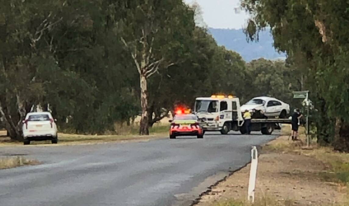 Kynan James McFarland's Ford Falcon is removed from the crash scene in Lake Albert after he drove over police road spikes on April 6. Picture: Supplied