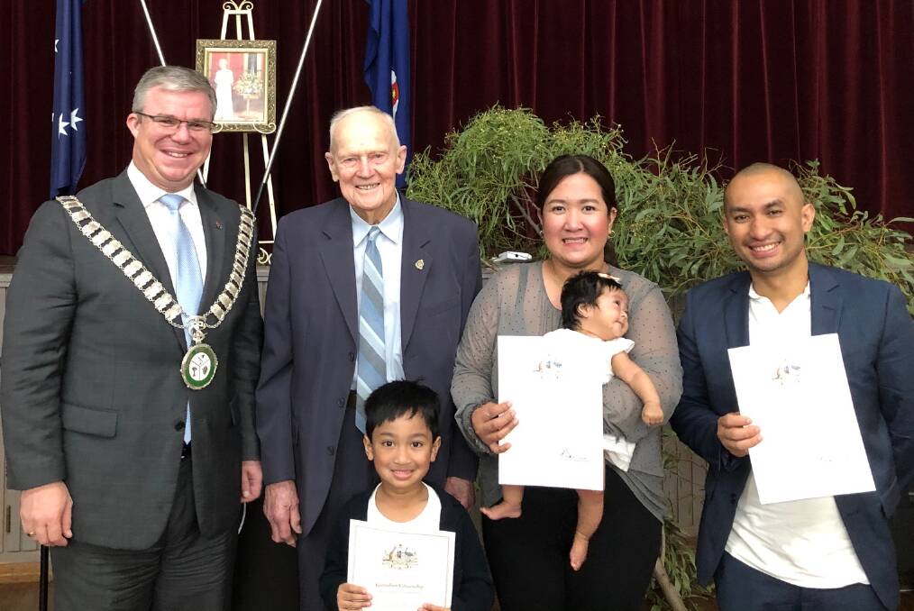 Temora mayor Rick Firman had the honour to naturalise three Australian Citizens - Karen, Jayzon and their son, Karzon Rebebis - in front of a restricted crowd of just over a 100 on Australia Day. Picture: Supplied
