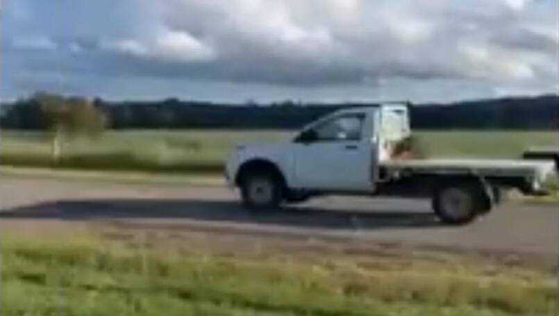 A Gobbagombalin resident captures the white Mazda ute travelling along Old Narrandera Road on Sunday afternoon. Police allege Griffith man Simon Carberry was behind the wheel and led officers on a number of pursuits before deliberately crashing the ute into a highway patrol car near the Pine Gully Road intersection. Picture: Supplied. 