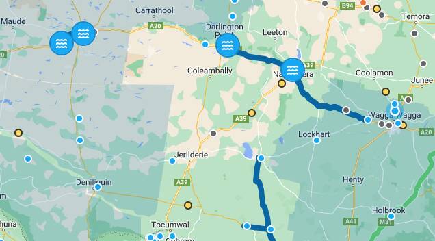 Flooded section of Riverina highway reopens but big detours still in place