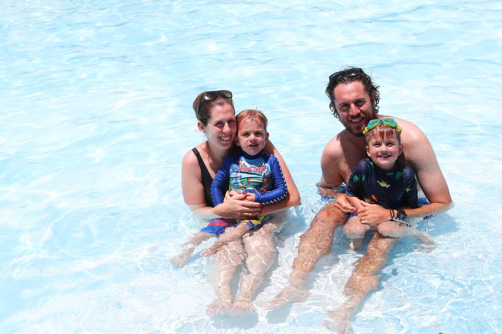 Laura, Noah, 2, Alex and Archie Burns, 4, from Ganmain beat the heat at the Narrandera Water Park on Sunday. Picture: Emma Hillier
