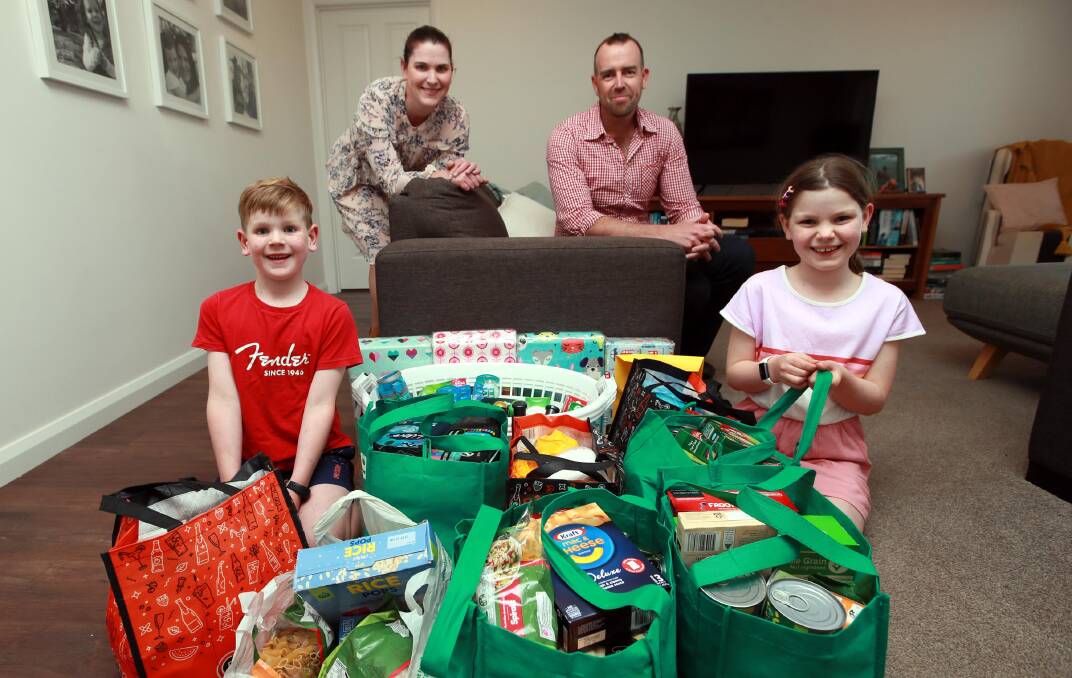 Ben Elliott with his wife, Aimee, and his children Spencer, 7, and Gracie, 10. Mr Elliott hopes the donations his initiative is collecting for the Wagga Women's Health Centre and Sisters Housing Enterprise will help women and children escaping domestic violence. Picture: Les Smith