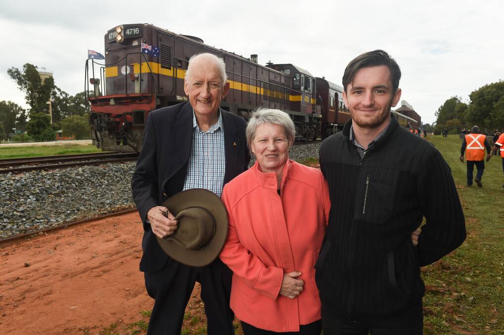 Tim Fischer with wife Judy Brewer and son Dominic at Boree Creek last month. He took a train from Albury to the village, where a park named in his honour was unveiled. Picture: Mark Jesser