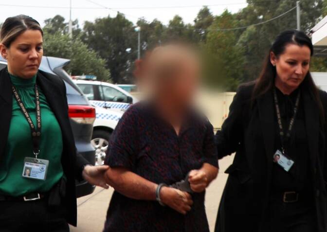 CHARGED: Anne Geeves is arrested at a property near Harden on May 4. Ms Geeves and her former husband, Robert, have been charged with murder. Picture: Police