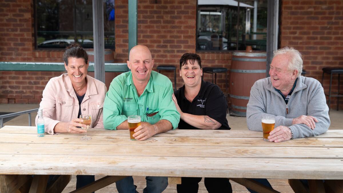 Illabo Co-Operative directors Fiona Hamilton (left) and James Croker enjoy a drink with Illabo Hotel publican Krissy Aurisch and co-lessee John Jackson. Picture by Madeline Begley