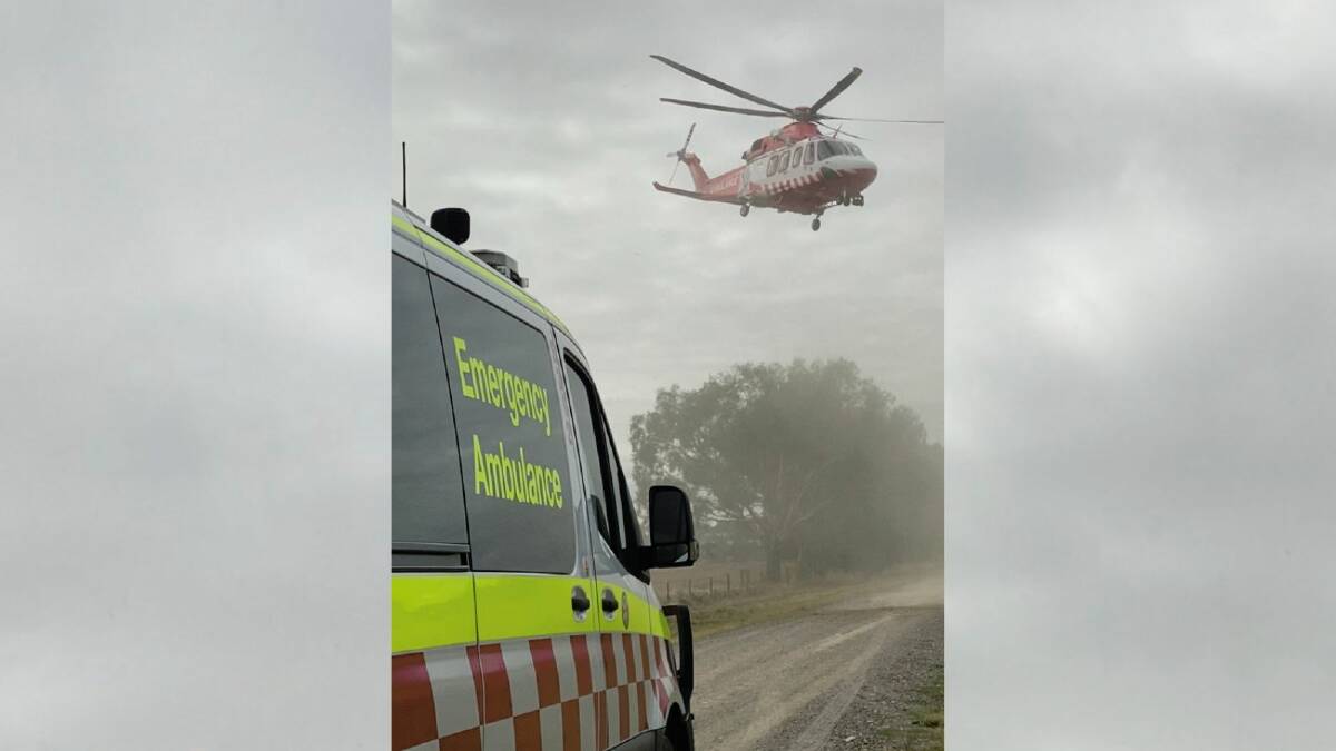 The Victorian ambulance rescue helicopter at the scene of the tractor incident south of Berrigan on Friday. Picture by Ambulance NSW
