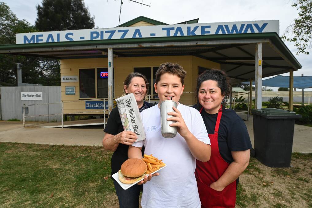 Urana Takeaway and Newsagency owners Sue Macgregor and Michelle Forrester, with 12-year-old Cash Forrester. The family moved to the town from Sydney last year, and are loving it. Picture: Mark Jesser