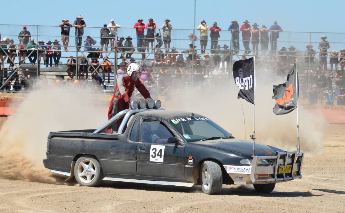 CAPTAIN RISKY: Old Junee's Anthony White gets moving in the circlework championship with his 'friend' a mannequin called Captain Risky bolted to the back. Picture: Declan Rurenga