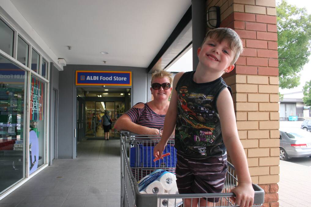 SHOPPING TRIP: Kylie Waddell and her helper, Riley, 5 outside Aldi believes any ban on plastic bags has to be for all bags. Picture: Declan Rurenga