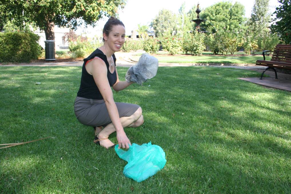 WWCC environmental education officer Alice Kent collects some plastic bags which are most common items of litter, and could be banned. 