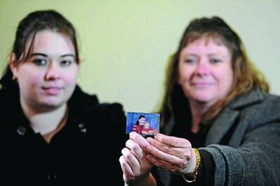 FAMILY: Melissa Hodder and her mother Rosalind Wright hold a photograph of Amber Haigh that was taken in 2002 just before she vanished. Pictures: Addison Hamilton