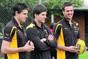 HOMECOMING: Emerging Hawthorn stars (from left) Isaac Smith, Luke Breust and Matt Suckling were back in the Riverina yesterday for a coaching clinic in Albury. Picture: The Border Mail