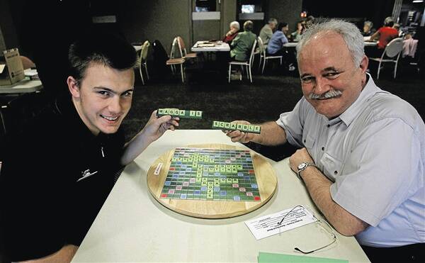 WORD JUMBLE: (left) John Hamilton and Tim Reddan share a light-hearted moment at the Threeway Interstate Scrabble Tournament held at the Wagga Commercial Club over the weekend. Picture: Addison Hamilton