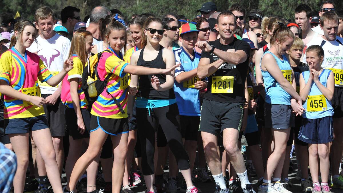 Opposition Leader Tony Abbott warms up before the race. Picture: Sara Schneider
