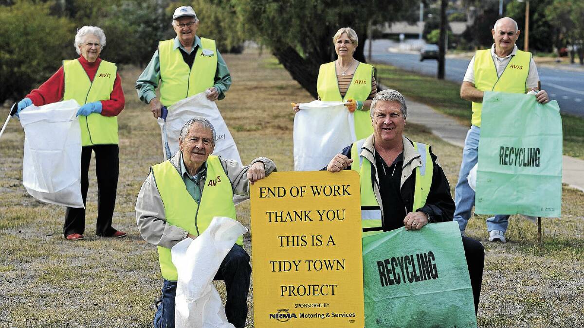 STANDING OUT: (Back, from left) Margaret Rumens, Ian Priestly, Judith Jackaman and Graham Jackaman, (front, from left) John Rumens (Wagga Tidy Towns committee chairman) and Steven Kimball (community business manager, NRMA Motoring Services) gather in Glenfield to pick up rubbish from the roadside. The committee must meet new safety regulations when cleaning. 	Picture: Addison Hamilton