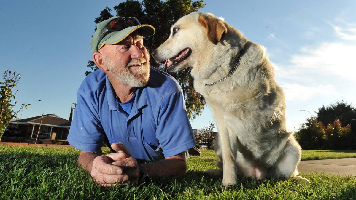 Brian Dreschler and his three-legged dog Sally. Picture: Les Smith