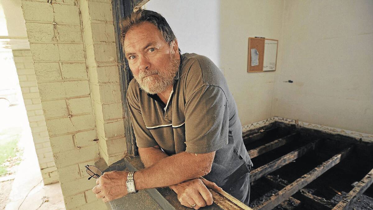 CLEAN-UP: North Wagga Residents Association president Laurie Blowes stands in his North Wagga home after the March flood event last year. Picture: Oscar Colman