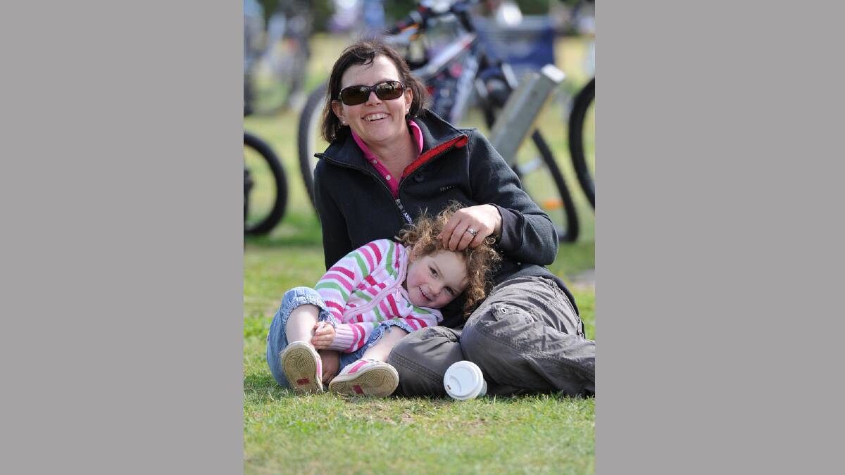 Indi Cole, 3, is a little bit tired after riding with her mum Rebecca. Picture: Michael Frogley
