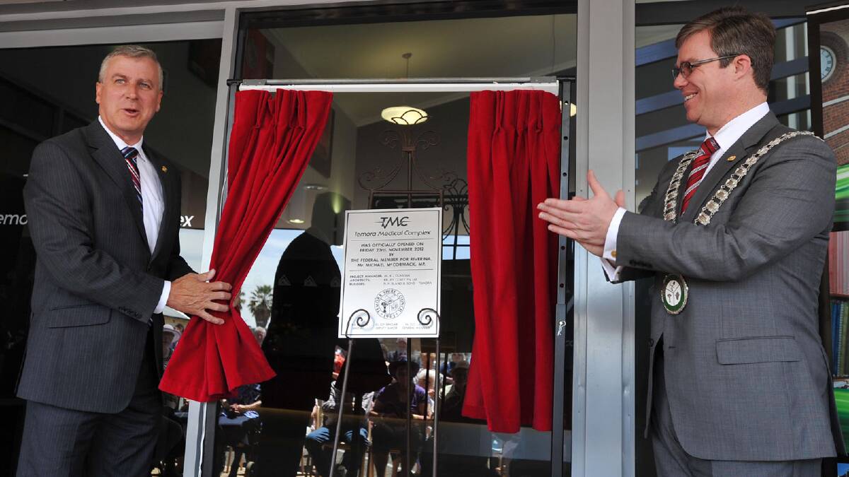 Member for Riverina Michael McCormack and mayor Rick Firman unveil the plaque. Picture: Michael Frogley