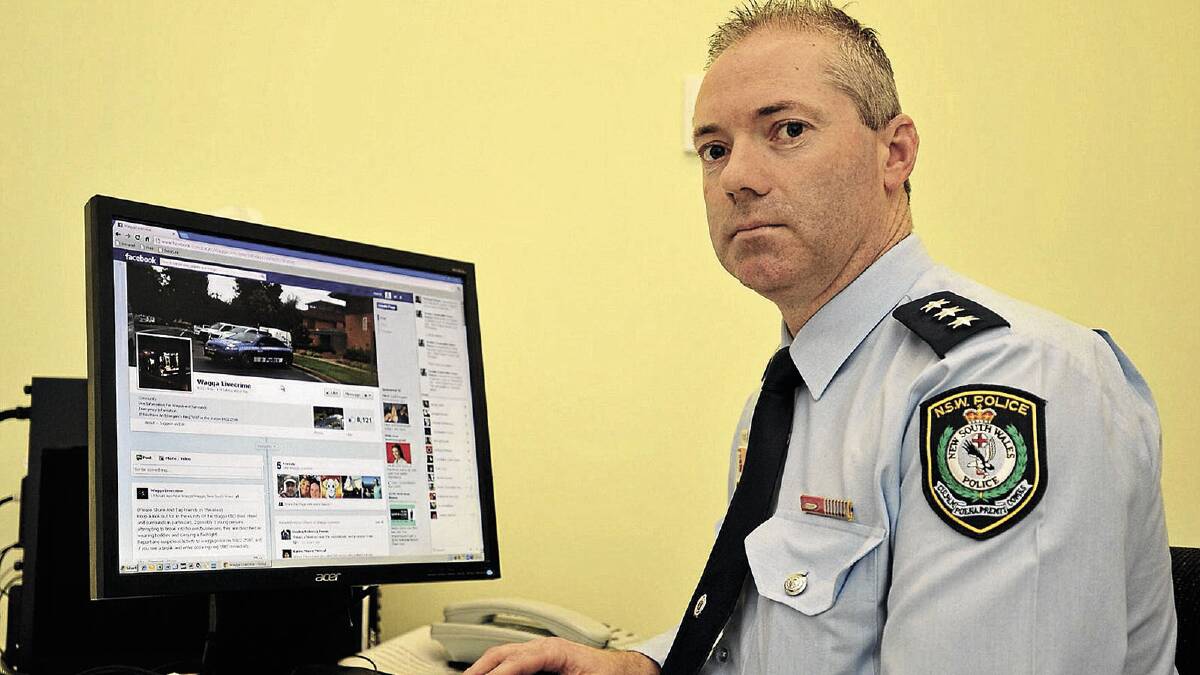 PUBLIC NUISANCE: Wagga crime manager Rod Smith looks at the Wagga LiveCrime Facebook page in his office yesterday.  Picture: Alastair Brook