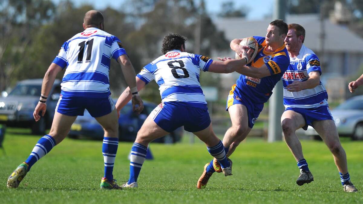 Group Nine Rugby League. Junee vs Cootamundra at Laurie Daley Oval. Junee's Daniel Foley and Coota's Nathan Corby, Grant Boyd and Aaron Byrne. Picture: Addison Hamilton