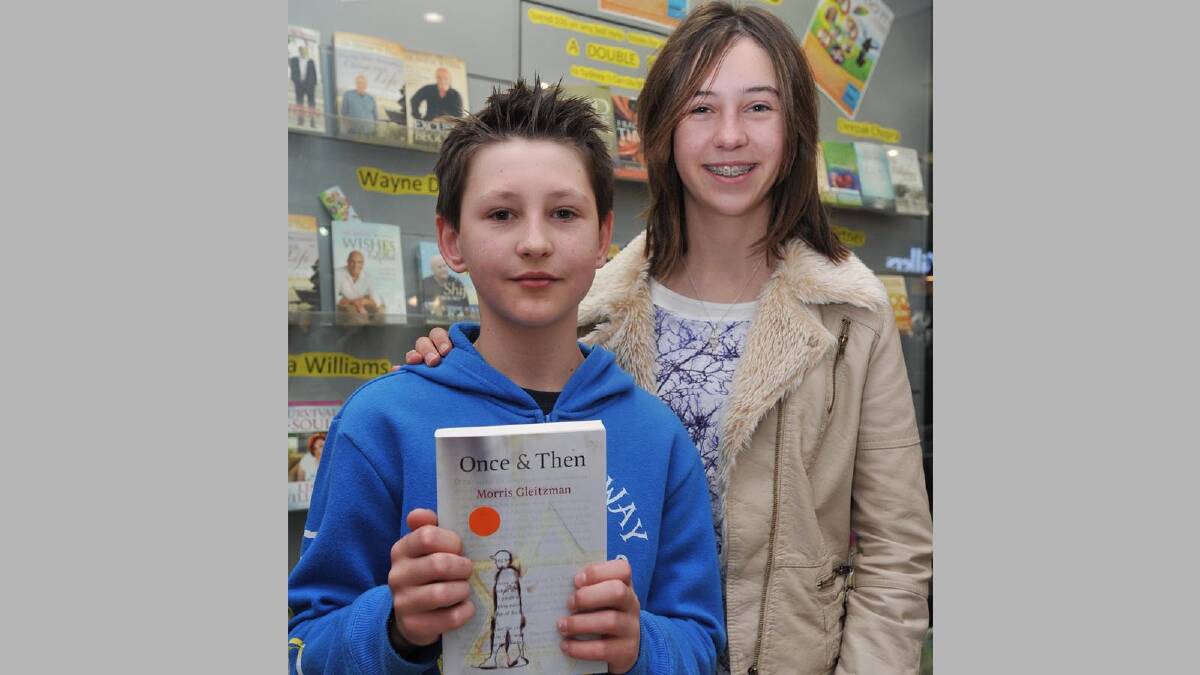 Children's writer Morris Gleitzman visits Wagga to sign his new book Extra Time, along with others. Ellis, 11, and Lauren Tidd, 14.