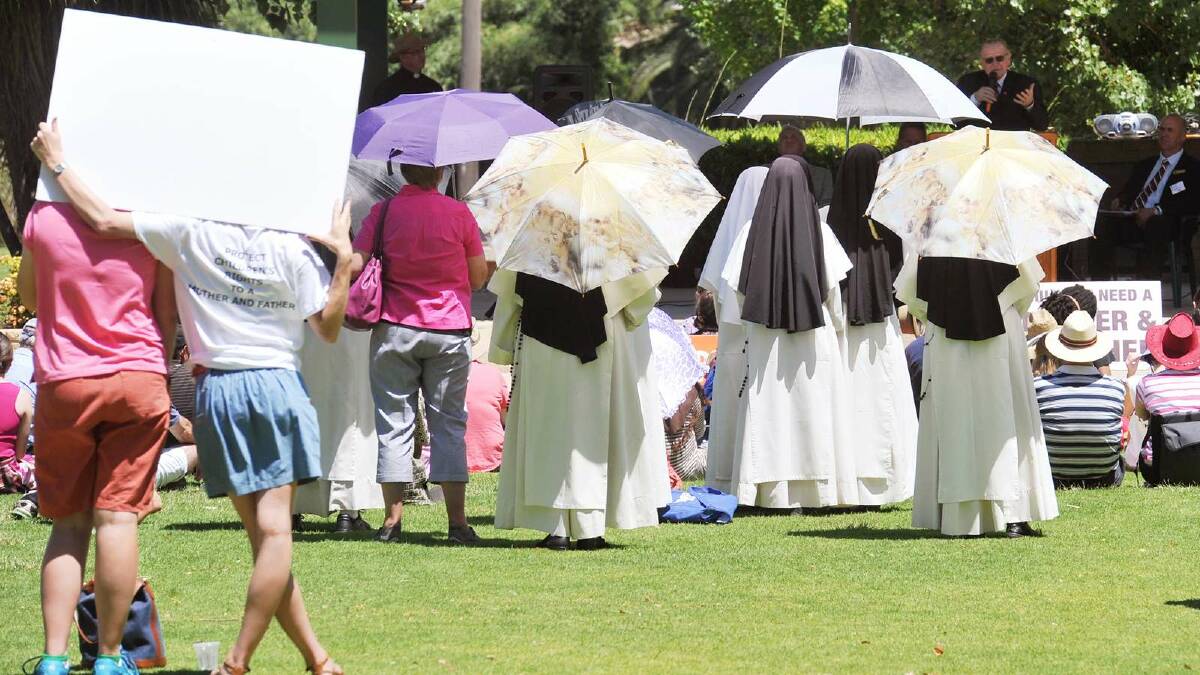 Nuns watch on as speeches are made at the True Marriage Day rally in the Victory Memorial Gardens. Picture: Alastair Brook
