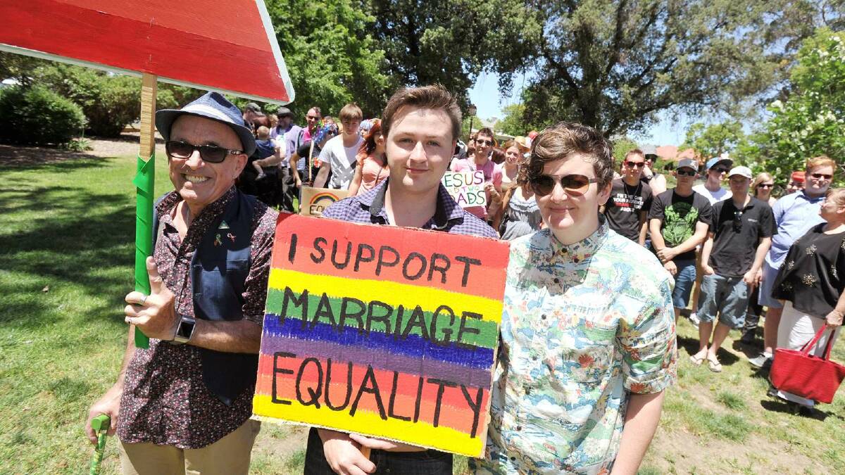 Ray Goodlass, organiser Naylan McDonell and Frankie Freeman head the march for marriage equality. Picture: Alastair Brook