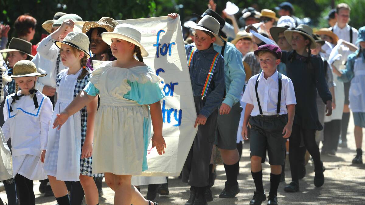 School children follow the march in period costume. Picture: Addison Hamilton 