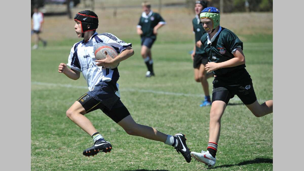 SIRU 10s ... Ben Keith (WWHS) gets around TRAC's Will Kirkpatrick to go in for a try. Picture: Michael Frogley