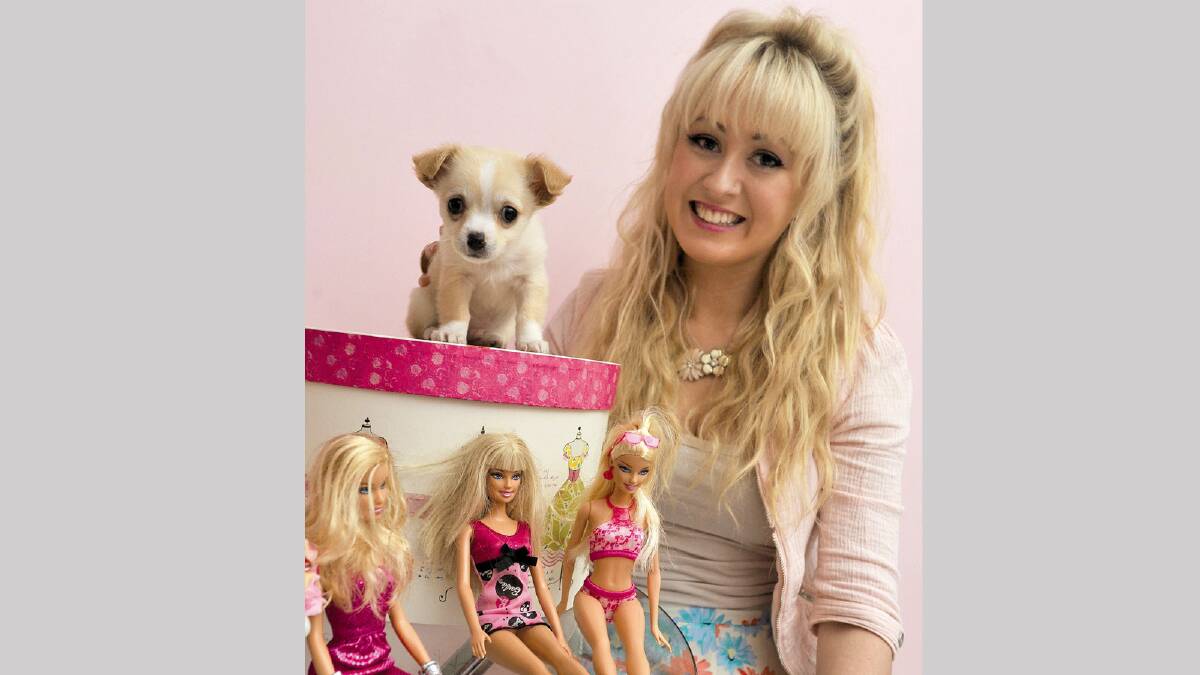PRETTY IN PINK: Wagga’s real-life Barbie, Bre Gorman, has survived another week on Beauty and the Geek. She’s with her new puppy Tuck. Picture: Les Smith