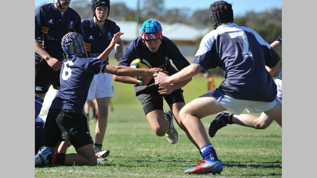 SIRU 10s ...red Heart's defence Ryan Connell and Harrison Howse face a stampeding Damiel Johnston (Yanco) going for his try.  Picture: Michael Frogley