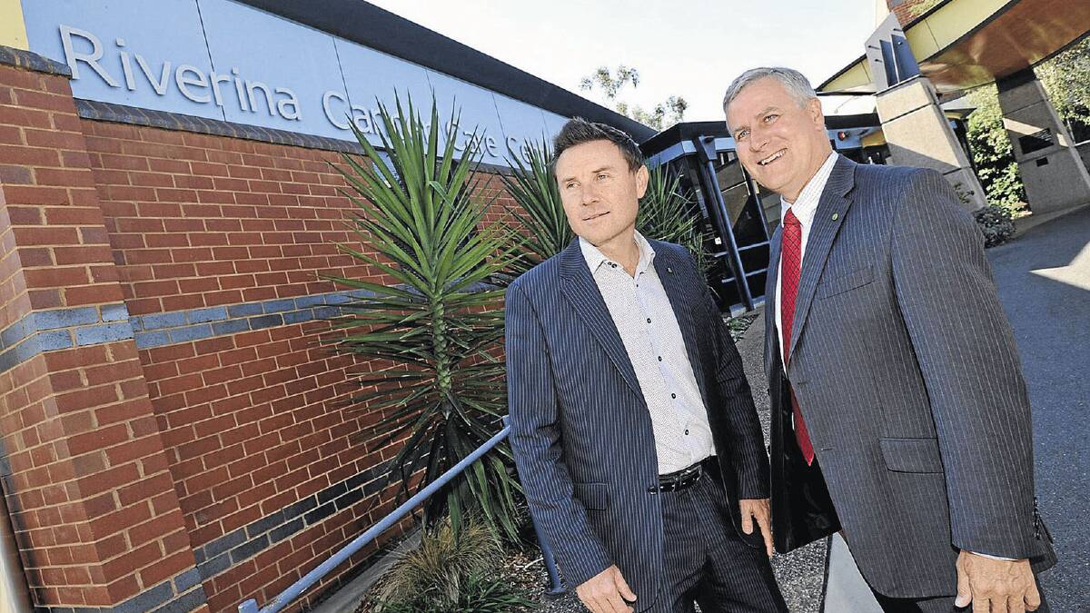 Opposition parliamentary secretary for regional health services Andrew Laming (left) was in Wagga yesterday with member for Riverina Michael McCormack. Picture: Les Smith