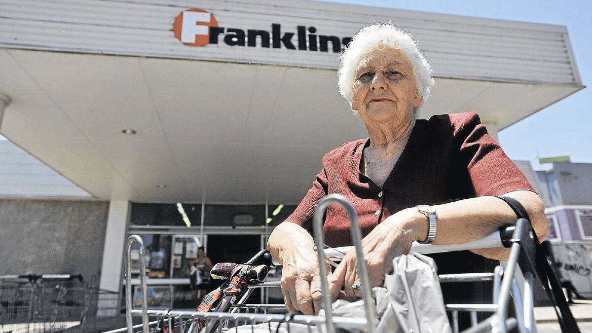 CLOSING: Long-time Franklins shopper Bev Pollard stands outside of the Peter Street supermarket yesterday. Picture: Oscar Colman