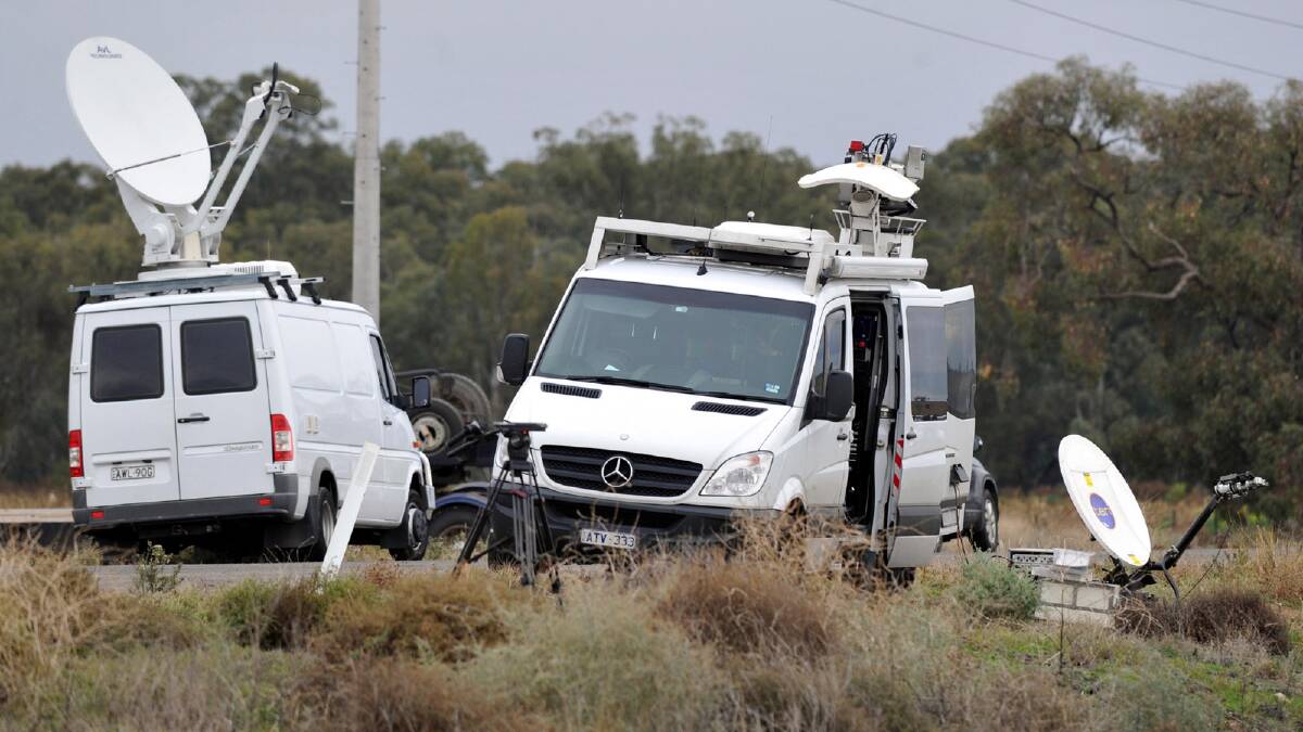 Media outside the Maude Road property as police search for the remains of Donald Mackay. Picture: Les Smith