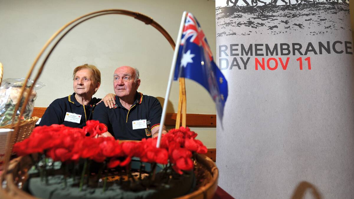 Marie and Alan Edwards selling poppys and merchandise for Remembrance Day. Picture: Addison Hamilton