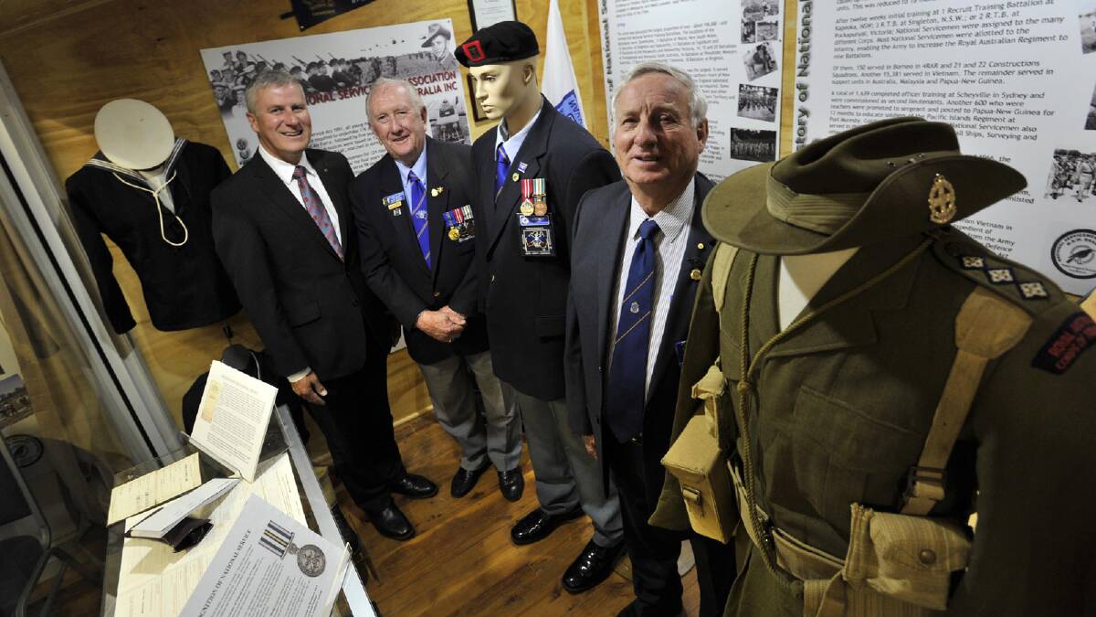 Member for Riverina Michael McCormack, National Servicemens Association NSW state president Ron Brown and president of the Coolamon RSL Bill Levy inside the National Servicemens Association exhibition at the RSL museum Coolamon. Picture: Les Smith