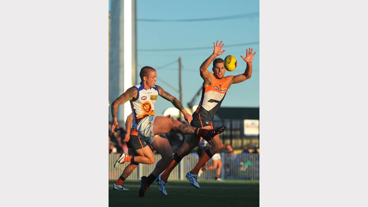 GWS v Brisbane at Robertson Oval - Claye Beams tries to get his kick past Stephen Gilham. Picture: Addison Hamilton