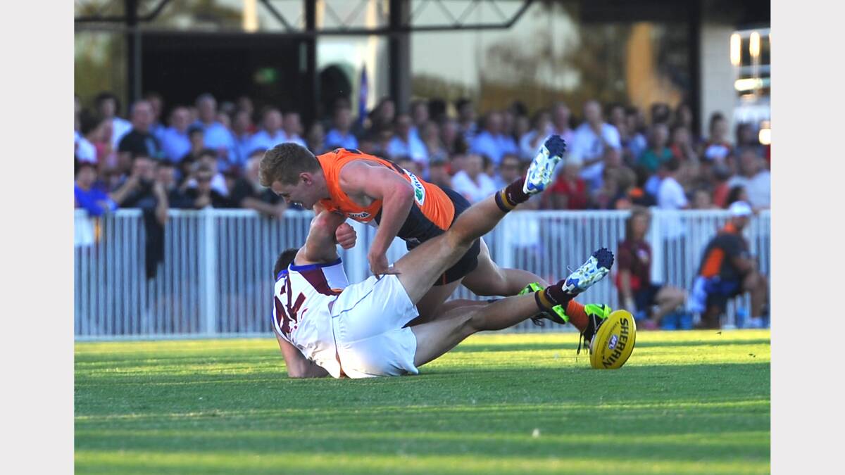 GWS v Brisbane at Robertson Oval - Leeton product  Jacob Townsend tackles Lions Justin Clarke. Picture: Addison Hamilton