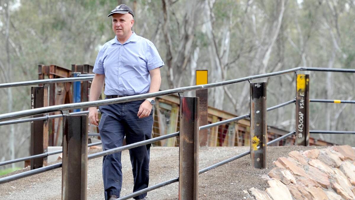 Adrian Piccoli inspects the Rocky Waterholes Bridge after its official opening as part of Narrandera's sesquicentenary celebrations. Picture: Les Smith