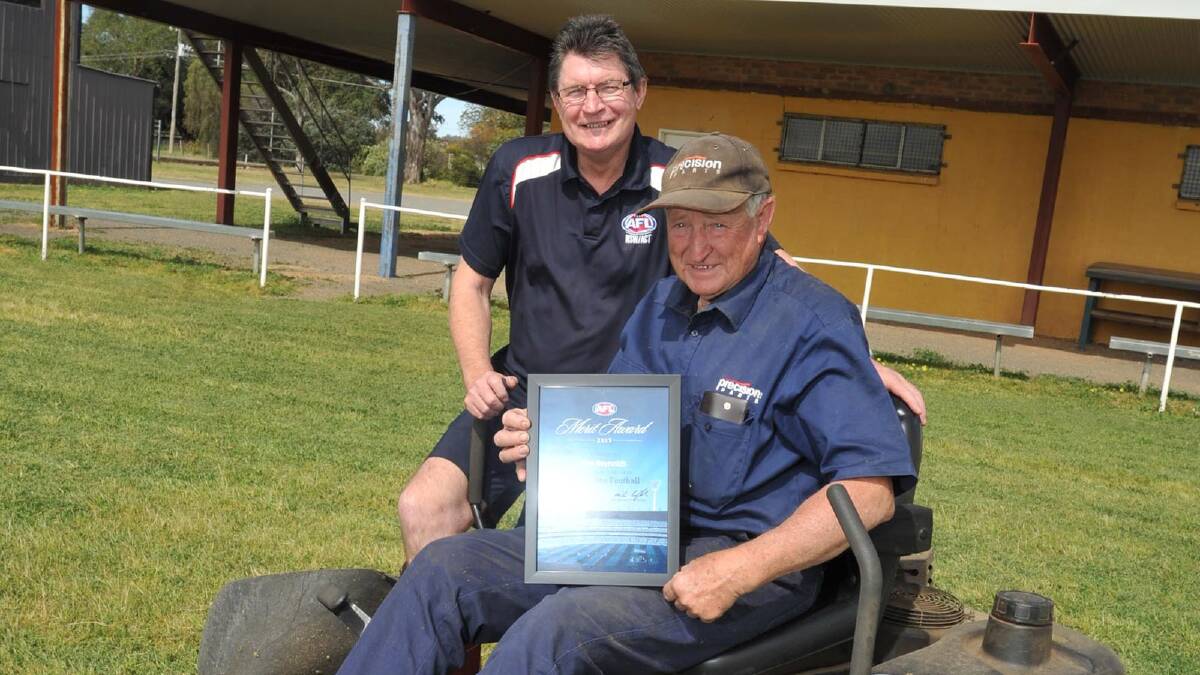 MOST DESERVING: East Wagga- Kooringal clubman Ken Reynolds shows off his AFL merit award at Gumly Oval, after being presented with the honour by AFL Southern NSW community football manager Paul Habel this week. Picture: Les Smith