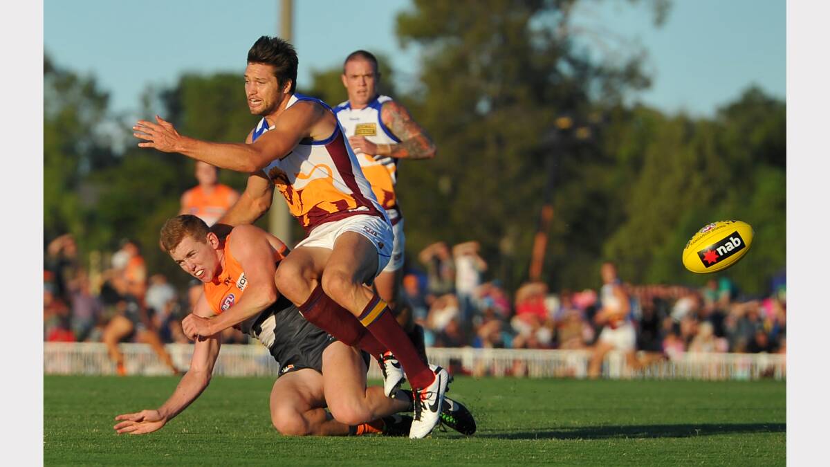 GWS v Brisbane at Robertson Oval - Jacob Townsend (GWS) Stefan Martin go hard for the ball in a contest. Picture: Addison Hamilton