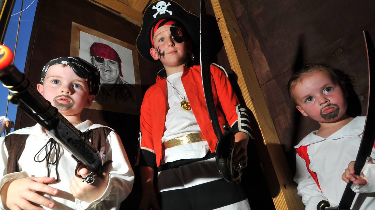 Jireh Sutton, 4, Samuel Ceccato, 8 and Claire Sutton, 2 ring in new year as pirates.