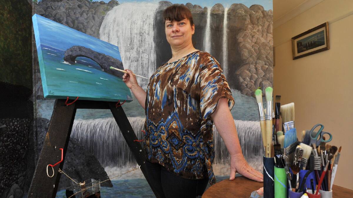  Vision impaired artist Donna Coulton will have her painting Ocean View included in Vision Australia's 2014 calendar. Picture: Les Smith